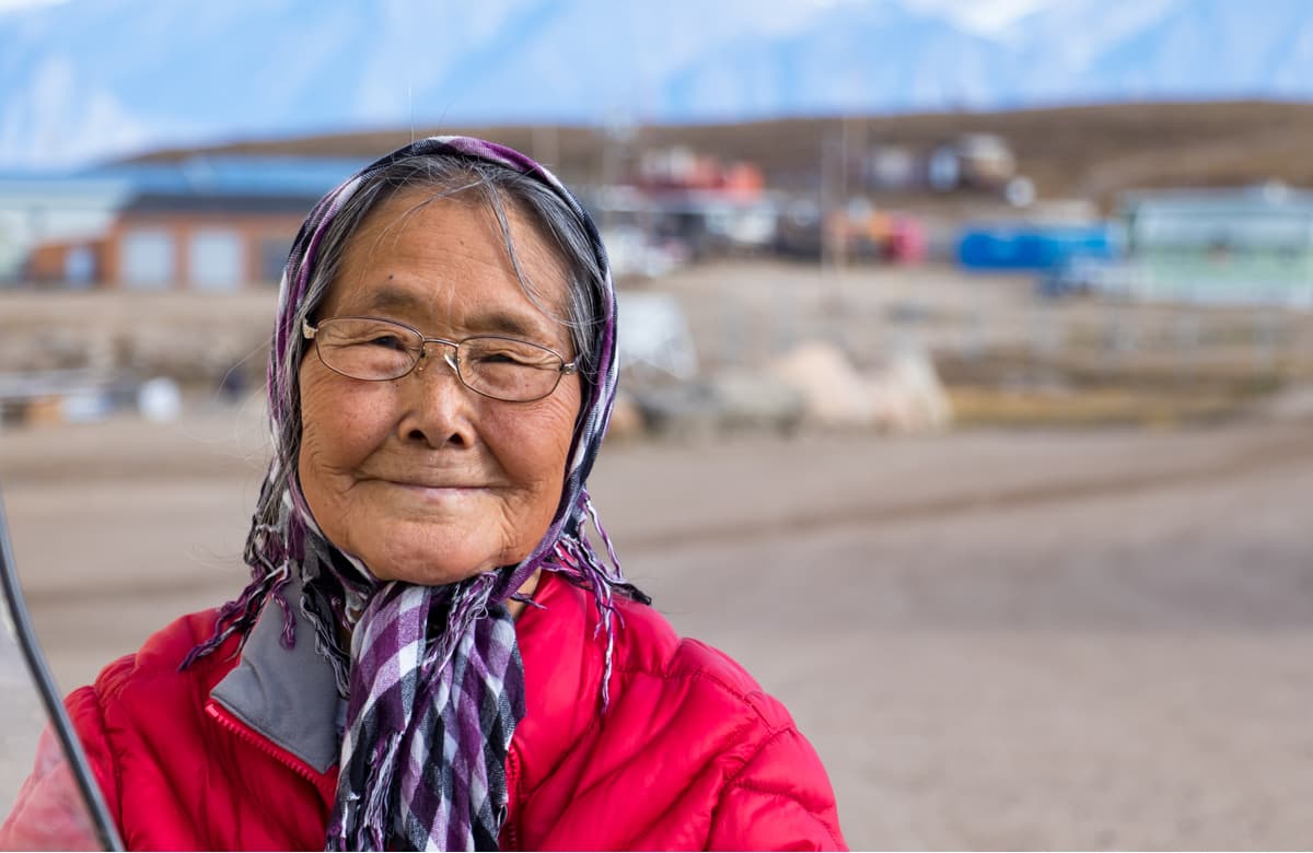 Eskimo - inuit senior woman outdoors in Pond Inlet, Baffin Island