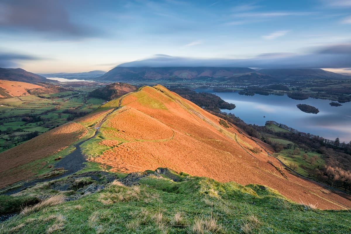 Beautiful golden morning light hitting the side of Cat Bells in the English Lake District