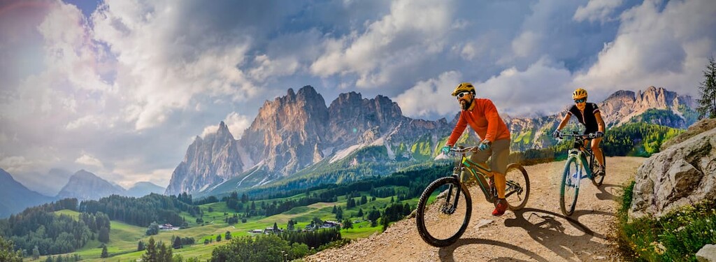 cycling on bike, rides mountain trail, Dolomites 