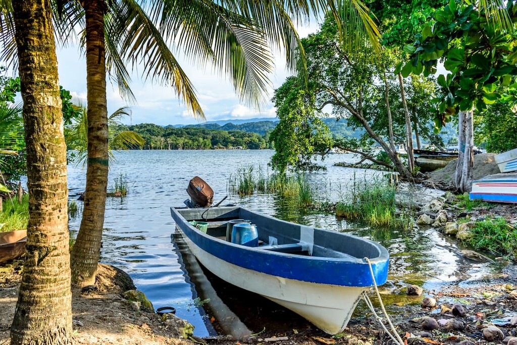 Boats in late afternoon light on Rio Dulce, Livingston, Guatemala