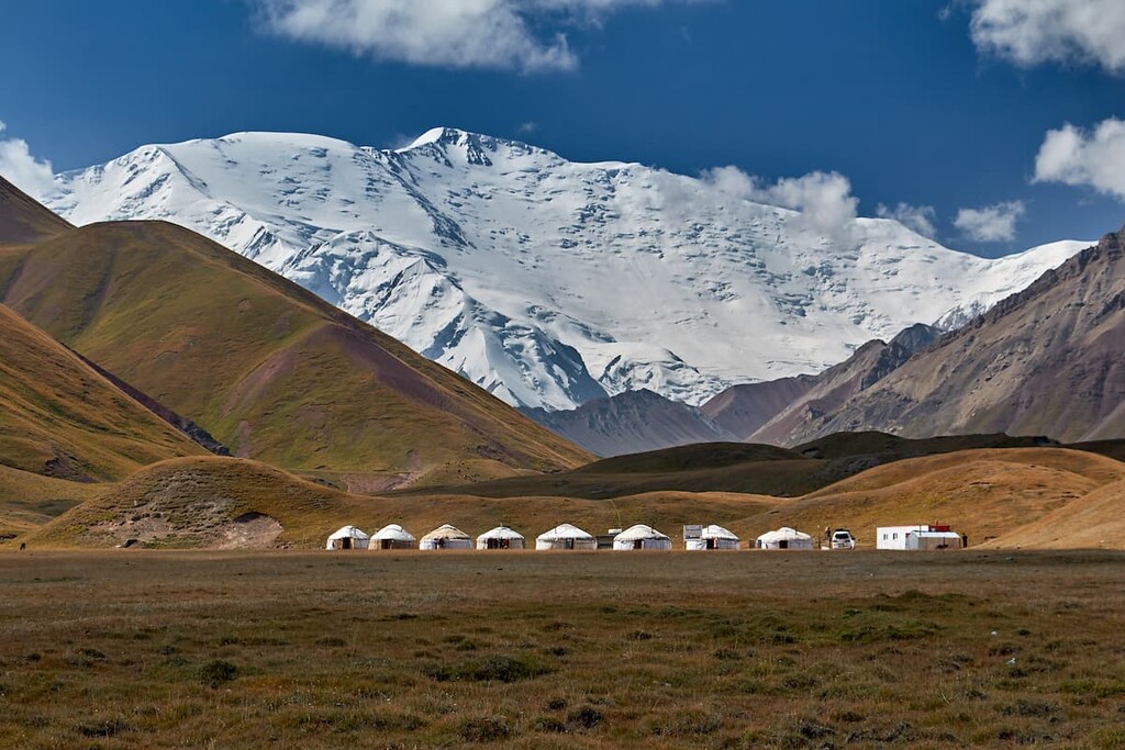 Lenin Peak with yurta camp in foreground, Kyrgyzstan