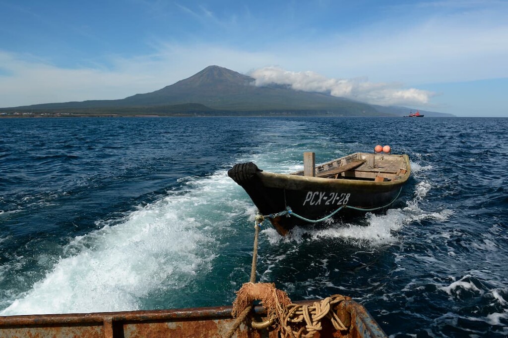 Fishing boat in tow, Iturup island, Ostrovnoy zakaznik, Russia