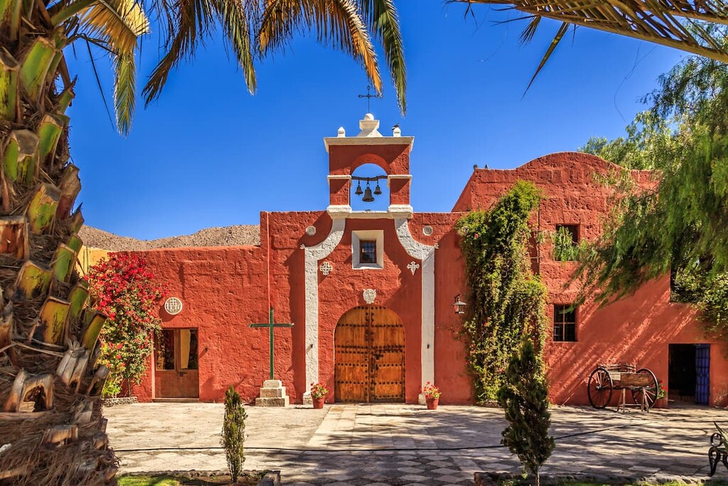 Red walls of a Spanish Catholic chapel, Arequipa. Peru.