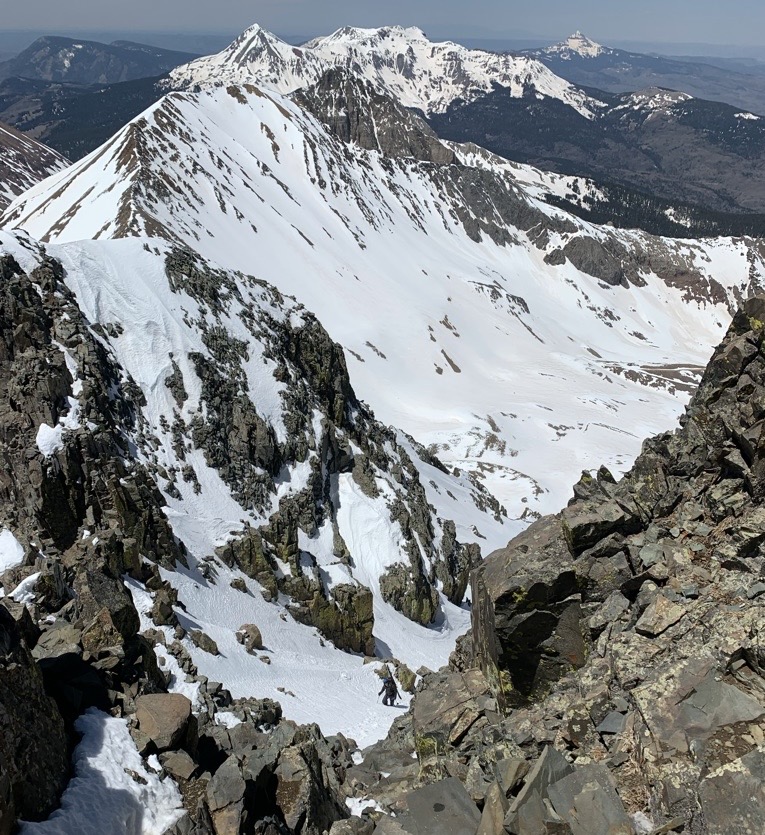 The final push to summit of Wilson Peak; looking west, with Mount Wilson, Dolores Peak and Lone Cone in the background. Photo: Andrew Orowitz. Skiing a San Juan Classic: Wilson Peak (The Coors Face), Northeast Couloir 