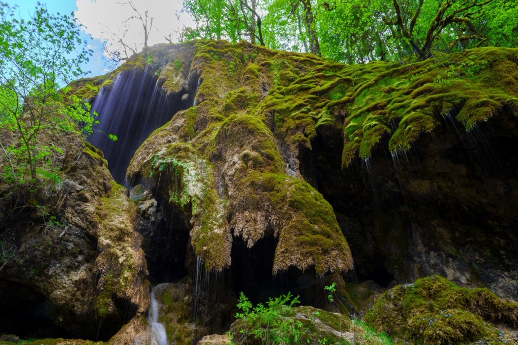 Lush mosses and waterfalls define the Ammer Gorge. Ammergauer Alpen