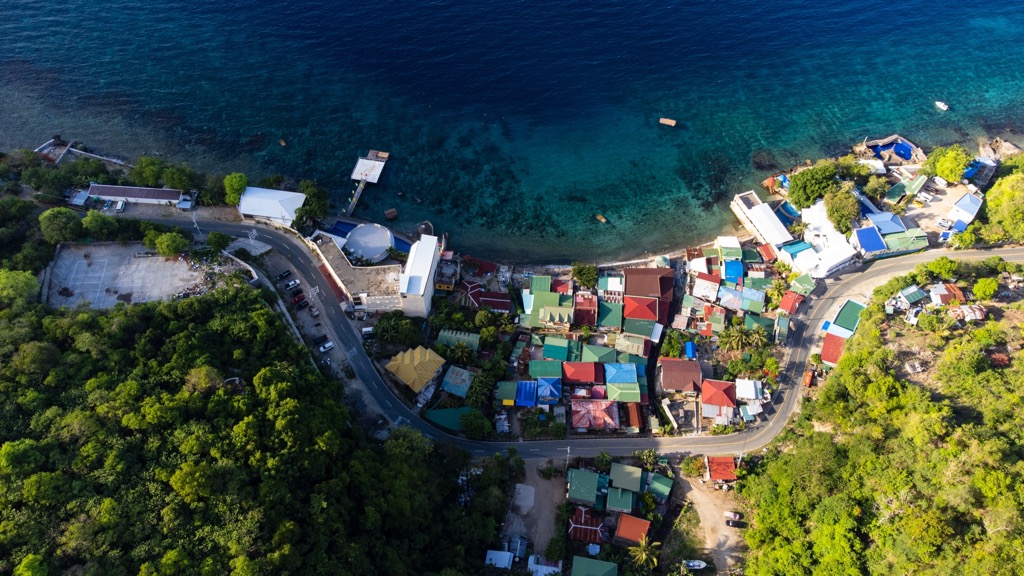 Colorful coastlines of Batangas City. Batangas Mountains