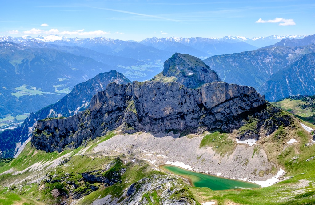 The Rofan Mountains are composed mainly of Triassic white limestone and Jurassic red limestone. Brandenberg Alps