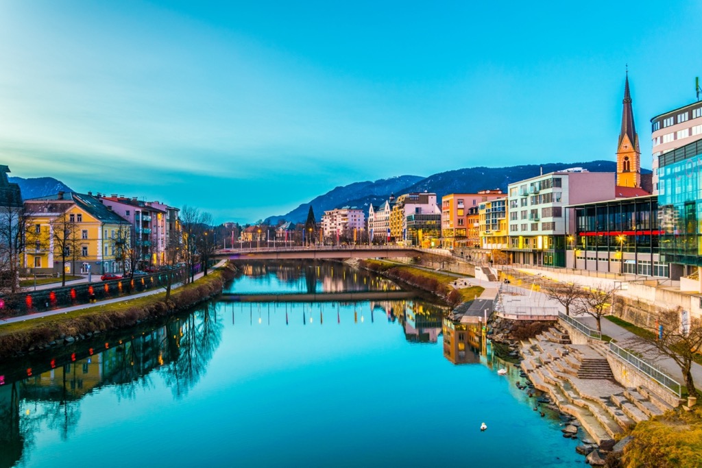 Villach as seen from the Drava River at sunset. Carinthia