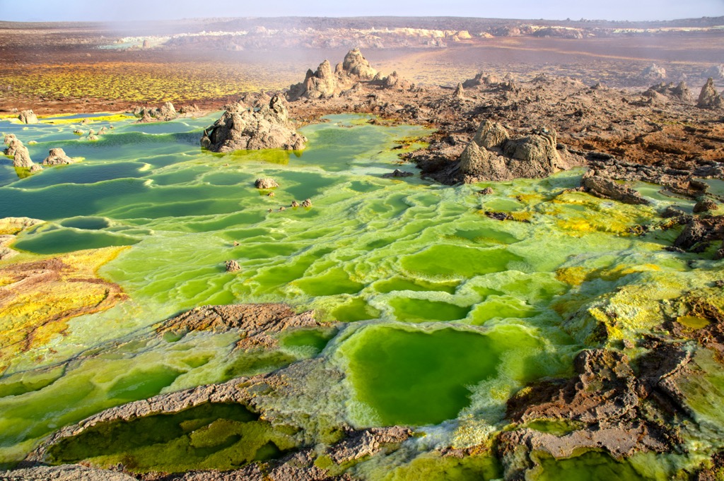 The Dallol volcano, with its colorful sulfuric lakes, sits just across the border in Ethiopia. Eritrea