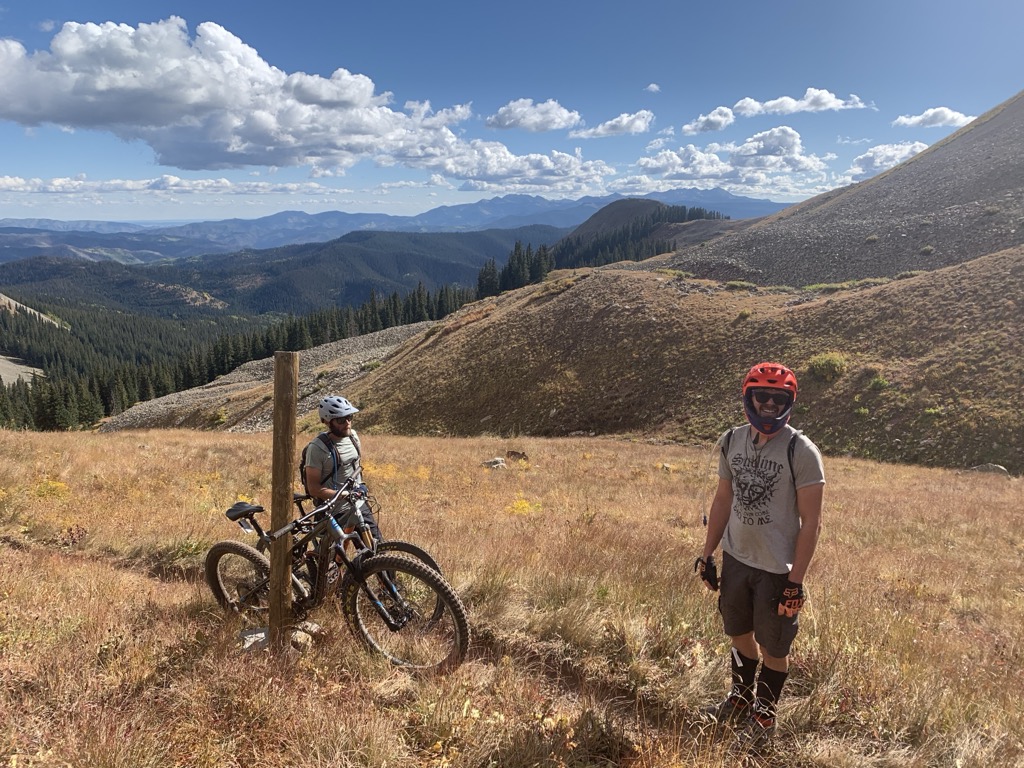 “Transporting your bike uphill.” Photo: Sergei Poljak. How to Start Mountain Biking