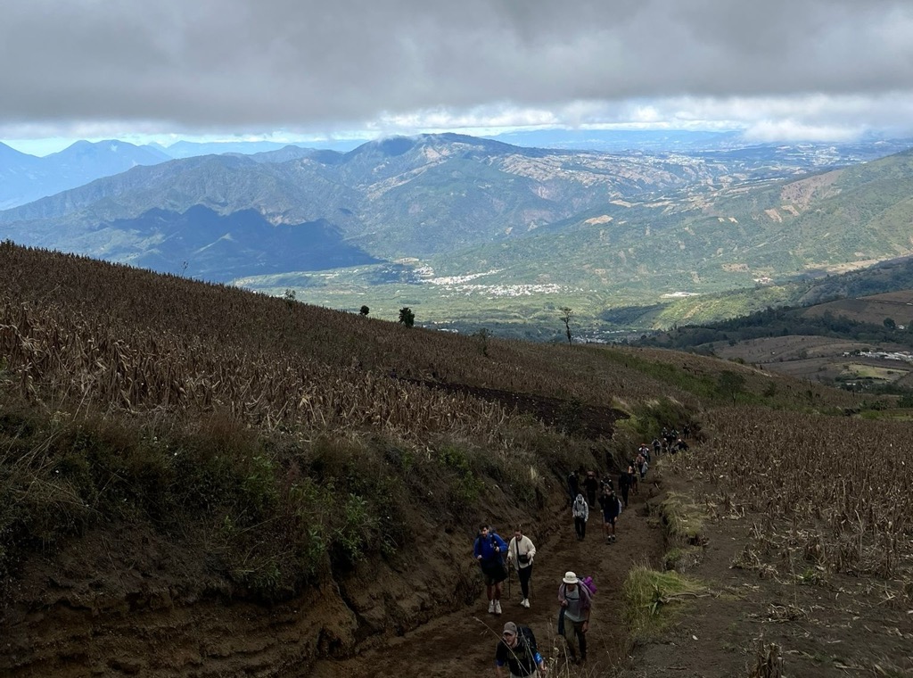 Leaving the fields of civilization before entering the forest. Photo: Anthony Butt. Trekking in Guatemala