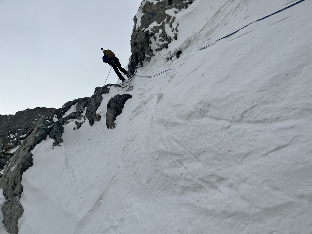 Rappelling into Trifide 1 during a low snow year. Photo: Sergei Poljak