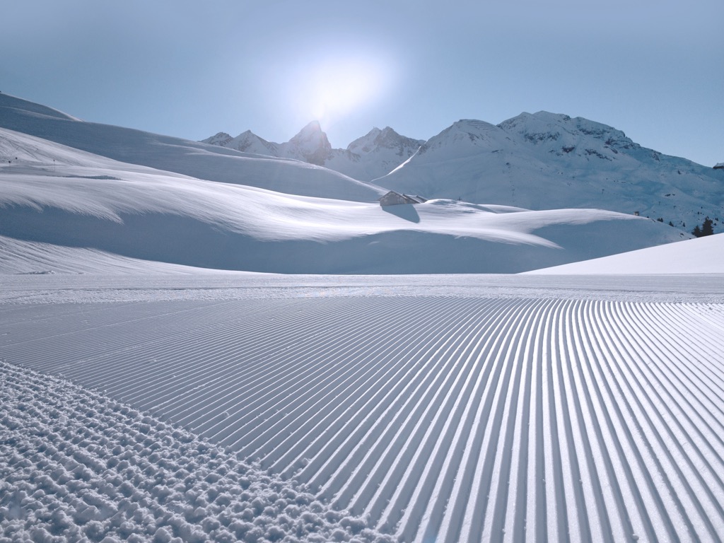 Fresh snow and groomed slopes at Lech. Lechquellen Mountains