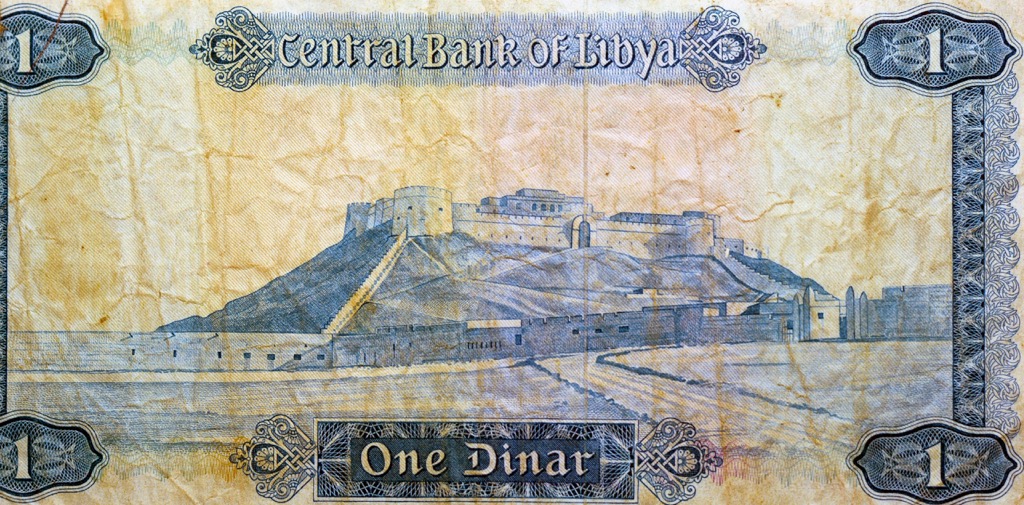 One Libyan dinar with Sabha fortress castle, Libya