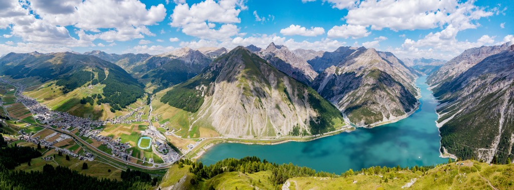 Panoramic aerial view of the lake and valley. Livigno Alps