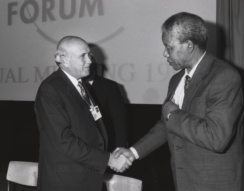 Nelson Mandela and Frederik de Klerk shake hands. Magaliesberg