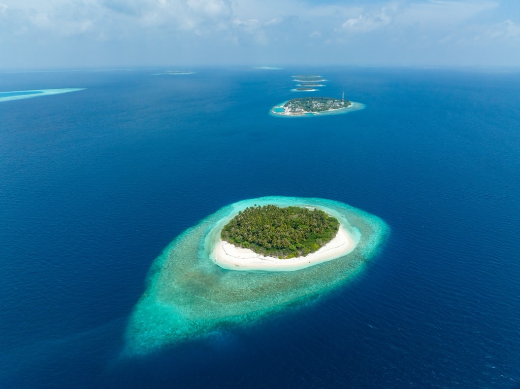 Aerial view of the tiny coral reef islands that make up the Baa Atoll. Maldives