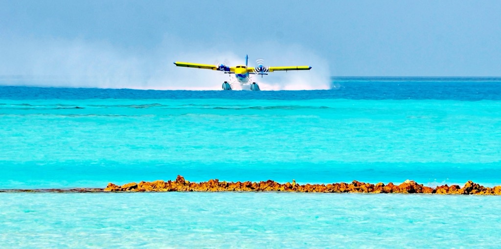 A seaplane landing in the Maldives. Maldives