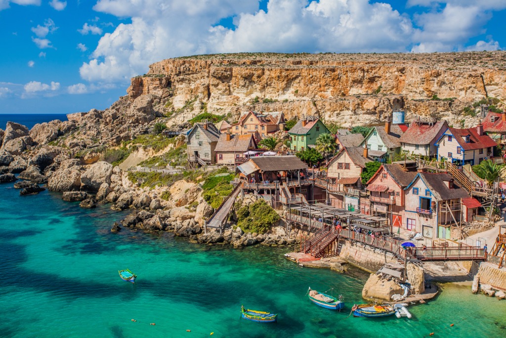 Malta Popeye Village at Anchor Bay with traditional Luzzu boats
