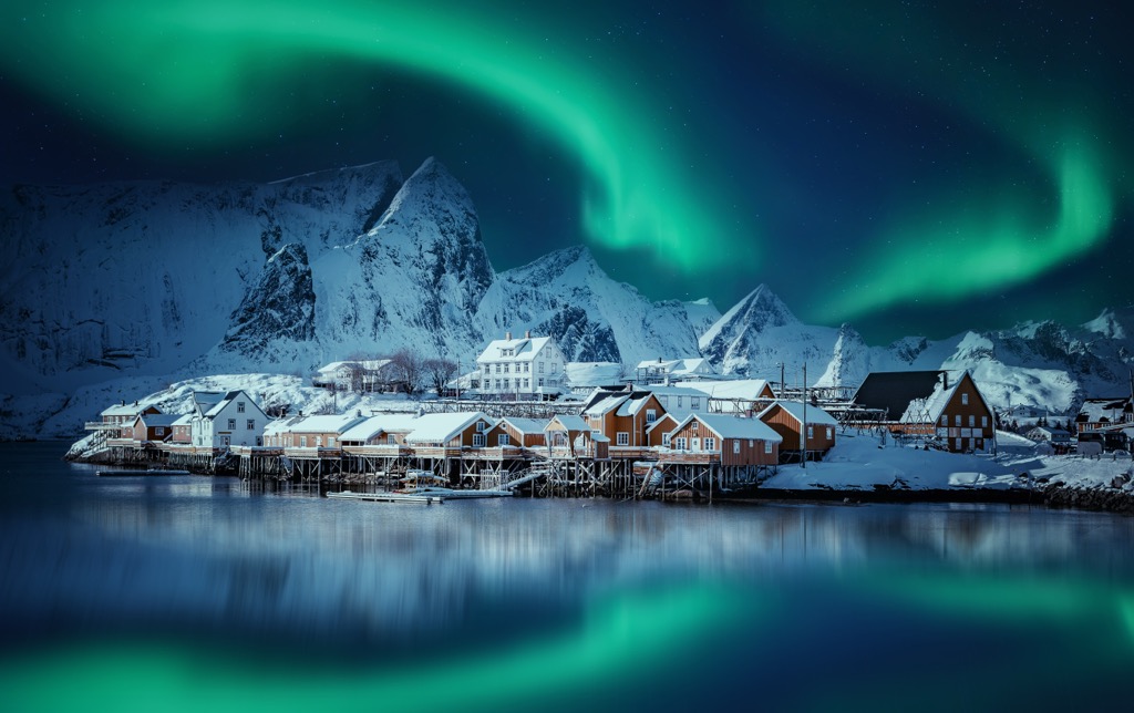 Reine, Lofoten, with the northern lights during winter. Norway