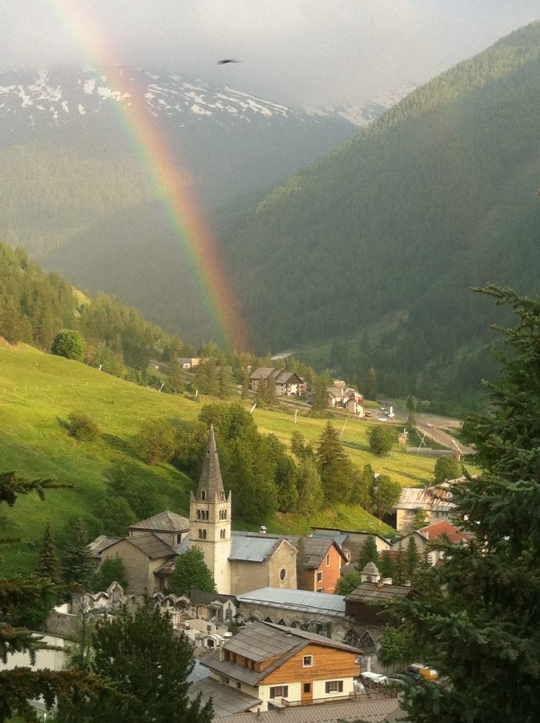 A rainbow in the village of Abriès. Parc Naturel Régional