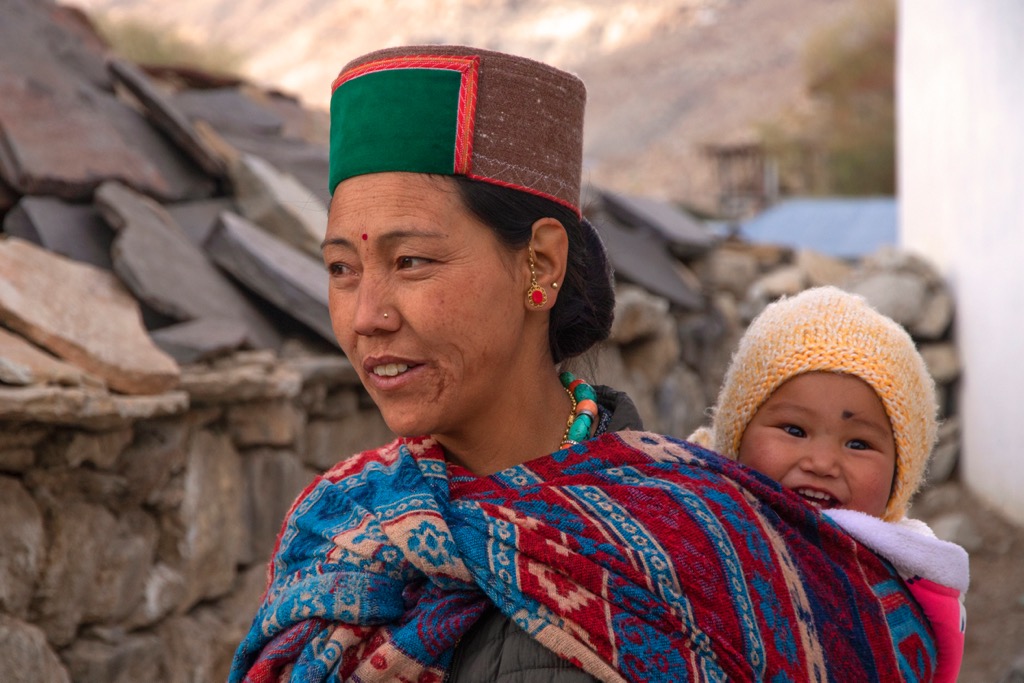 A mother carries her child in Mud Village, the last motorable settlement in the Pin Valley. In addition to their Buddhist ethos, the region’s residents possess the racial features of their Tibetan neighbors rather than the Indo-Aryans of the South. Pin Valley National Park