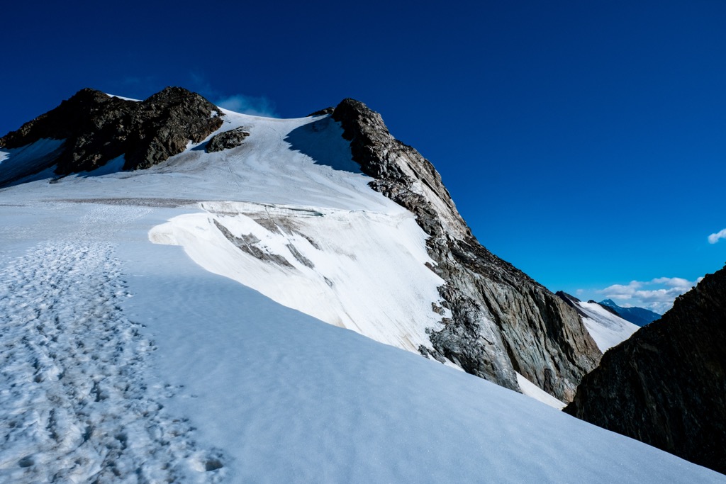 The summit of Weißkugel, with the tracks of mountaineers visible in the snow. Planol Mountains