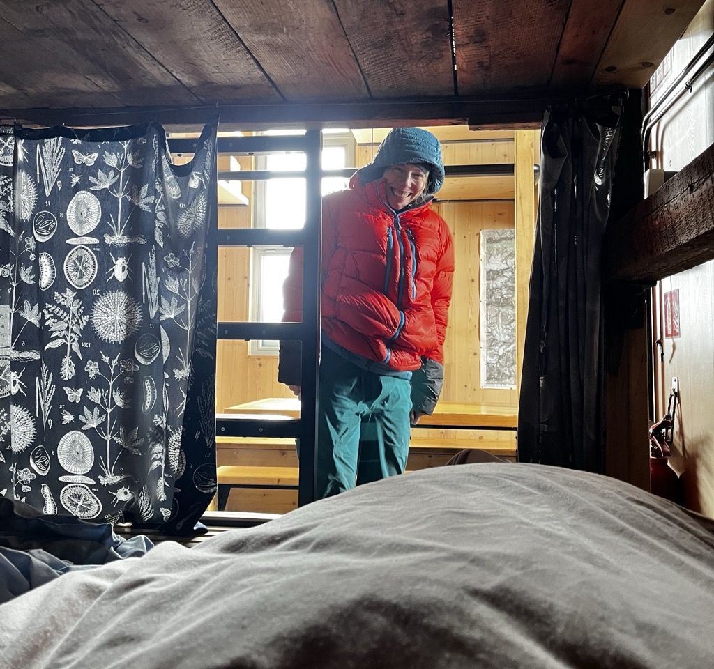 Anna is very excited to get to use my warm puffy to venture out to the bathroom. Photo: Sergei Poljak. Refuge d’Aigle