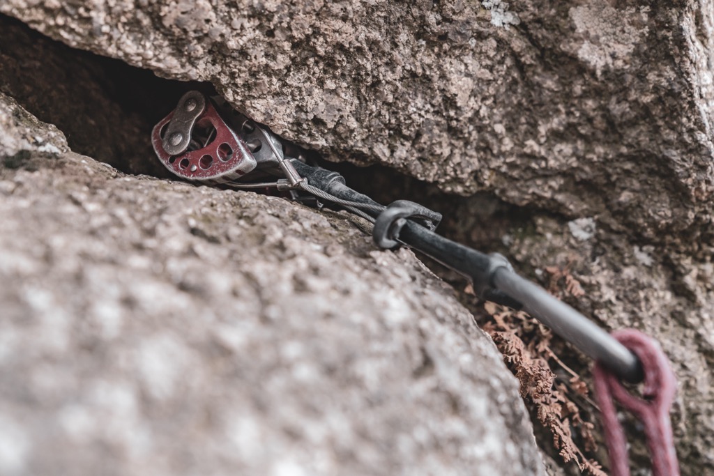 As outward force is subjected on a cam, the lobes are pressed tighter against the rock. Cams are incredibly strong, and a good placement can hold many times the force of a falling leader. Rock Climbing