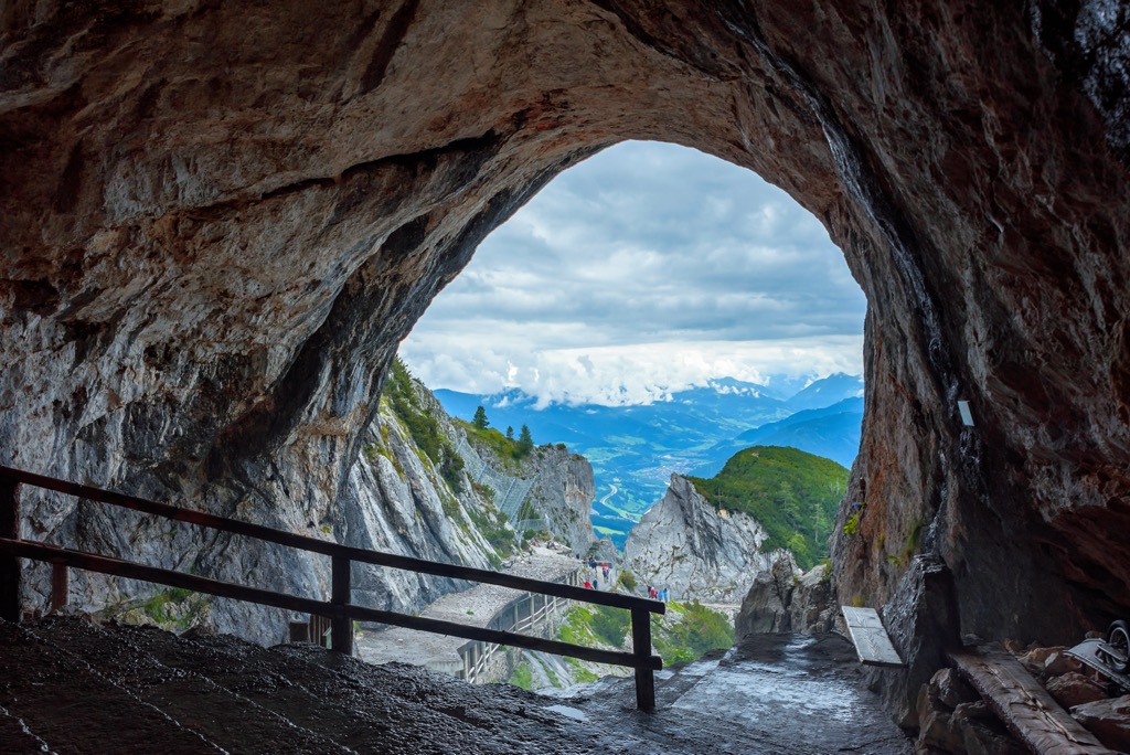 The entrance to Eisriesenwelt cave with the Berchtesgaden Alps visible. Tennengebirge Nature Reserve