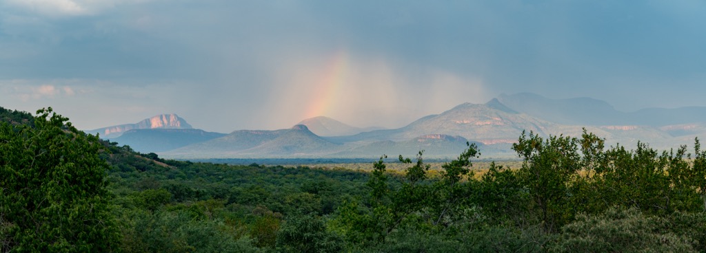 A rainbow over the mountains after a summer storm. Waterberg District Municipality