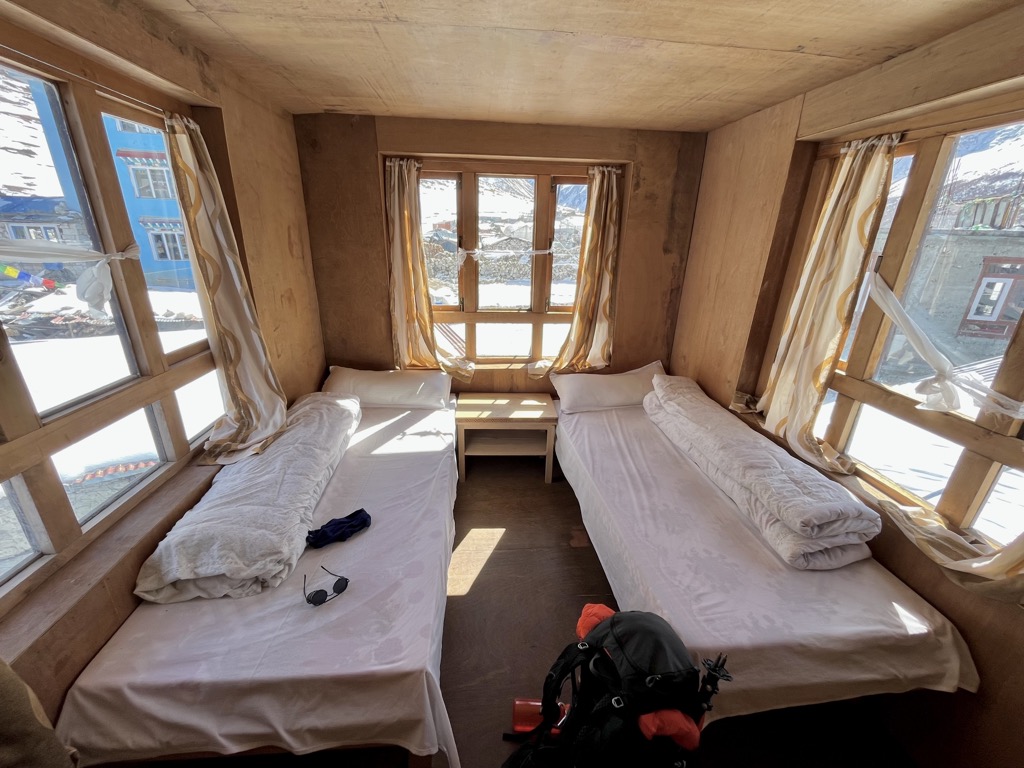 Rooms in guest houses are usually very comfortable, with warm blankets for the cold. Photo: Conrad Lucas. Western Development Region