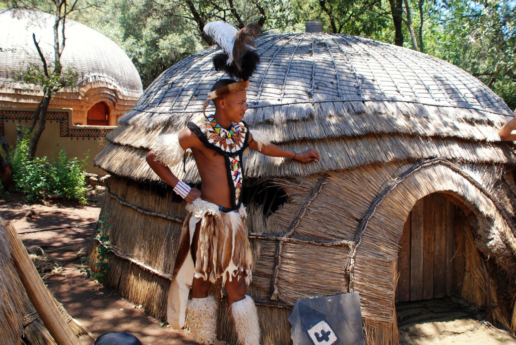 A traditional Zulu warrior dress featuring colorful beads and ornate animal skins. Zululand District Municipality