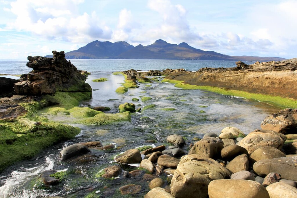 Isle of Rum viewed from the Isle of Eigg. Small Isles National Scenic Area, Scotland