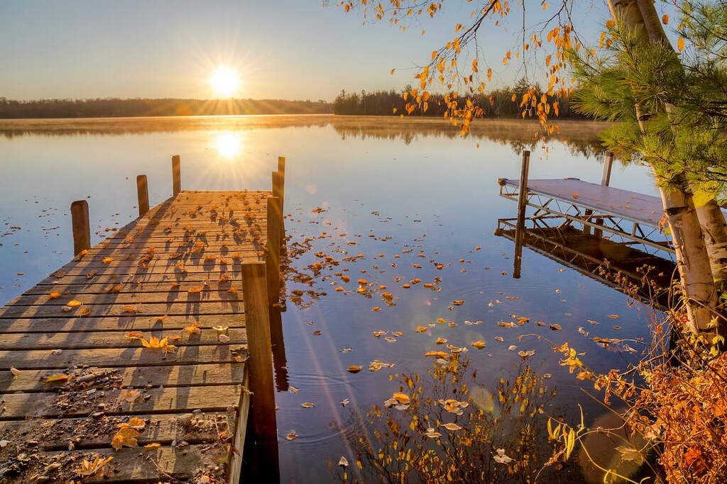 Autumn sunrise over dock on Moose lake in northern Wisconsin
