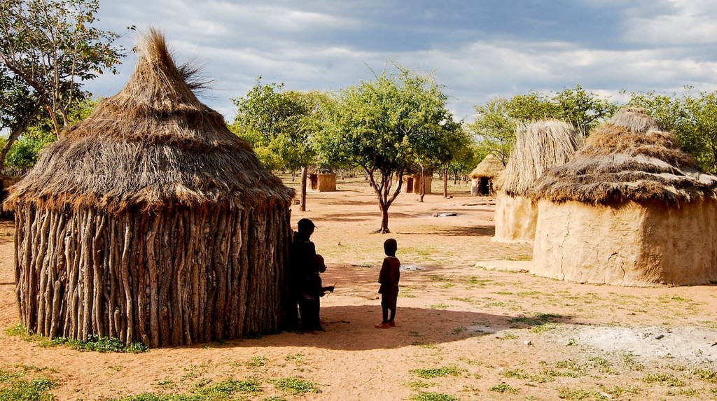 Himba village with traditional huts near Etosha National Park in Namibia