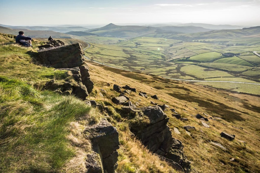 Man looks out over the view at Shining Tor